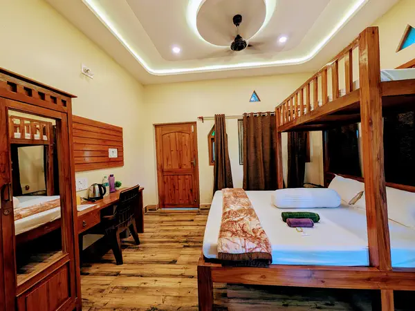 Wooden loft bed and ceiling lights in the super deluxe room